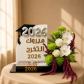 Class of 2026 Tribute graduation arrangement with orchids and silver 2026 balloons