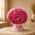 Fuchsia Bloom - large dome of hot pink and magenta spray roses wrapped in soft pink matte paper