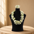 Ivory Garland graduation garland of ivory roses and baby's breath on a black bust