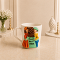 Mint and Marigold - white ceramic mug sculpted with a mother in mint green lettered THE BEST MOM with a girl in orange and a boy in yellow
