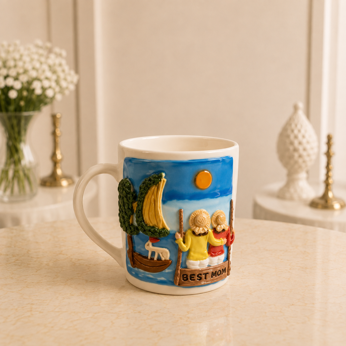 Shoreline Morning - cream ceramic mug sculpted with a seaside scene and two figures on the shore beneath BEST MOM