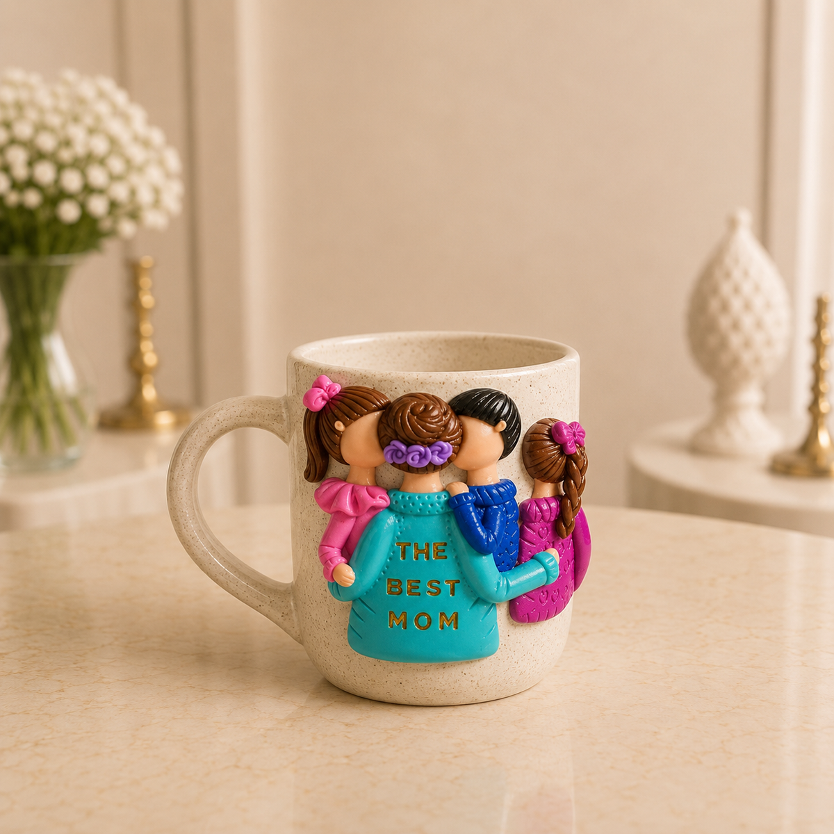 Turquoise Bond Mug - cream speckled stoneware mug sculpted with a mother in turquoise lettered THE BEST MOM and three children