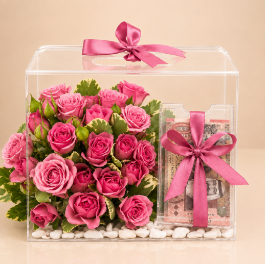 Rose Gift Box - Pink roses in a clear acrylic box with a pink satin bow and money gift compartment, clean beige background