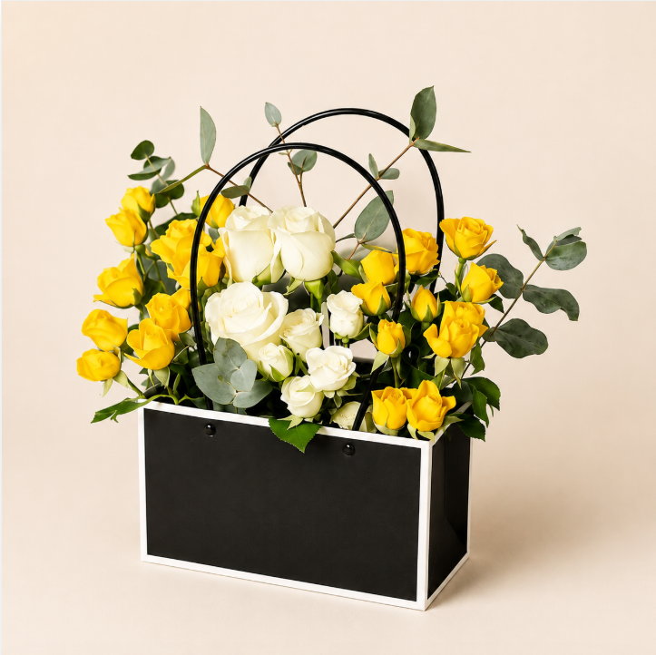 Sunny Charm Basket - yellow and white roses in a black and white patterned basket, clean beige background